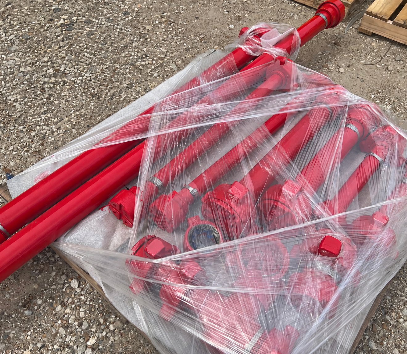 Wrapped flow iron pipe and fittings on a pallet
